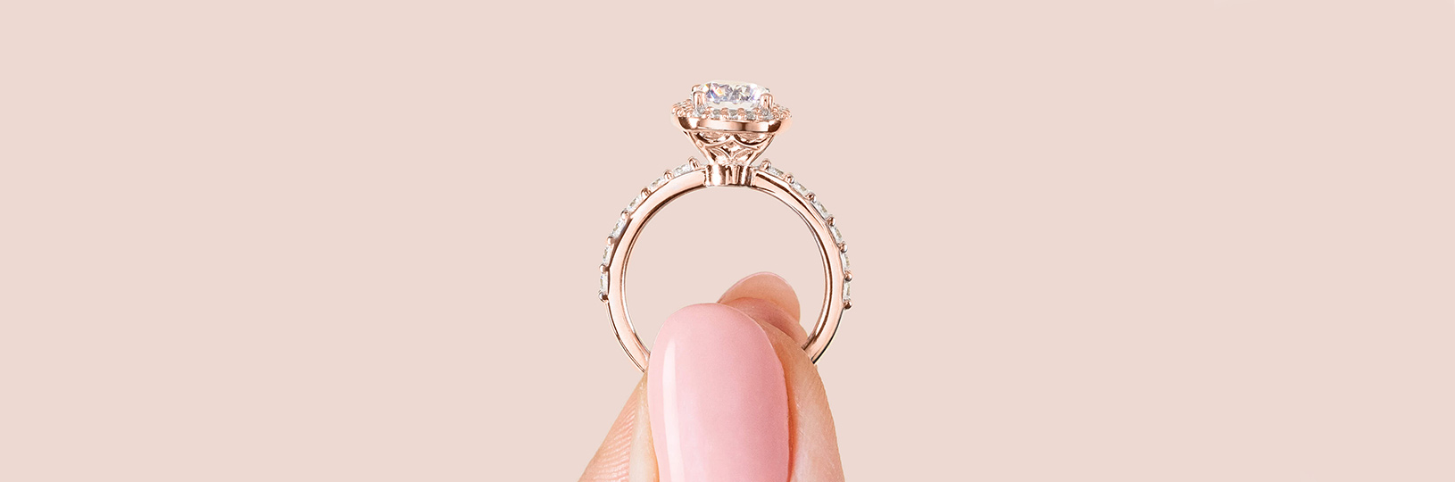 A rose gold engagement ring with an accented band