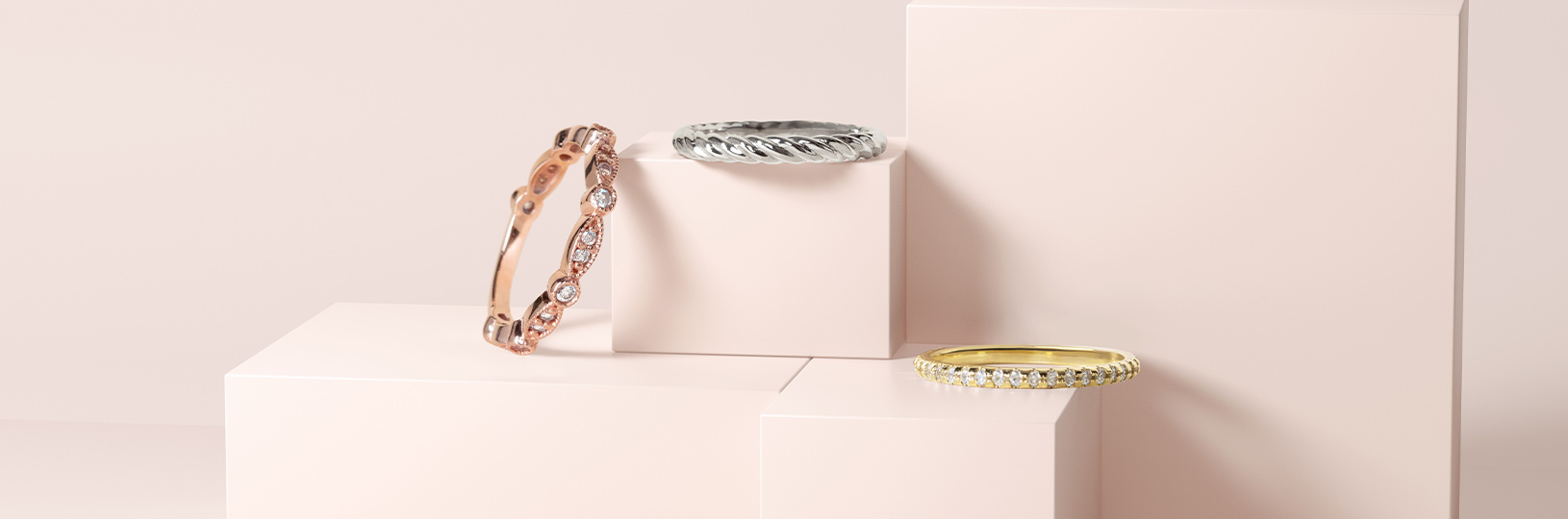 Rose gold, white gold and yellow gold wedding bands compared side by side