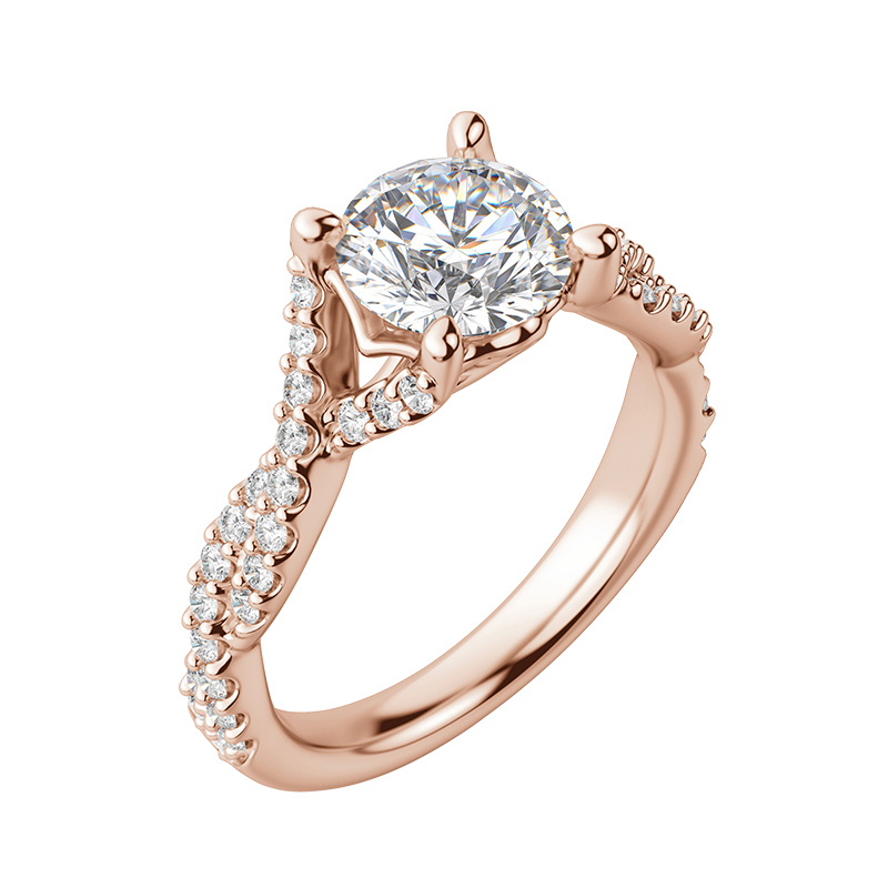 An accented engagement ring featuring a round cut center stone