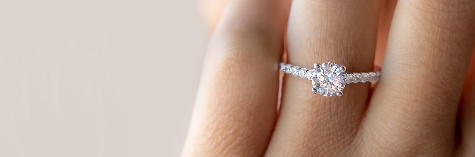 An accented solitaire ring
