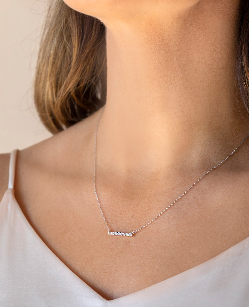 A trendy bar necklace featuring round cut lab grown diamonds