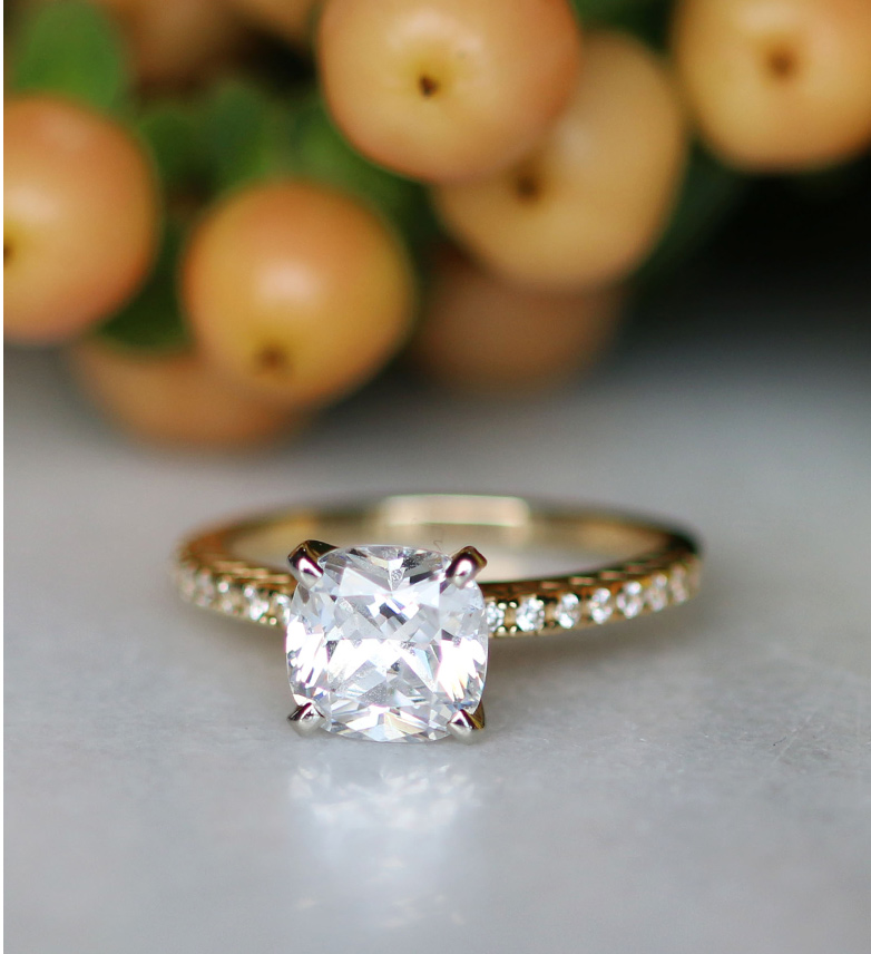 Image of an accented gold engagement ring