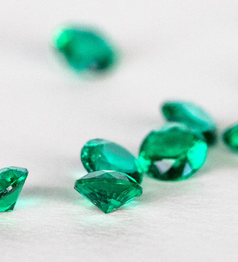 Several round cut emerald stones