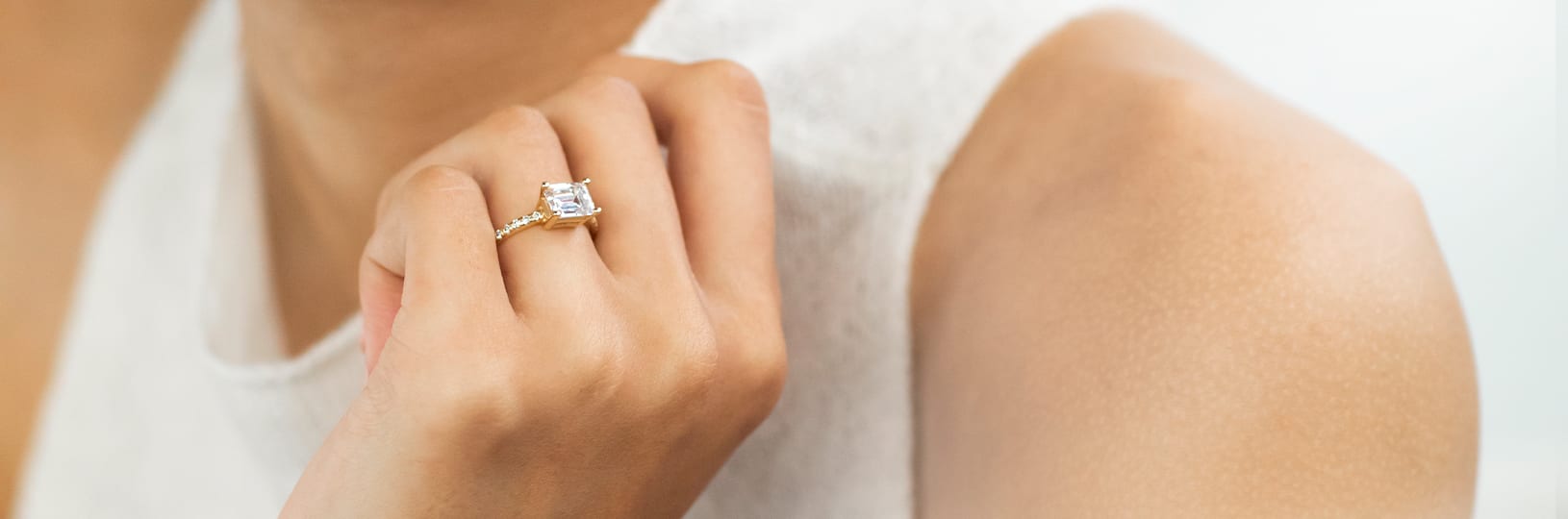 An accented emerald cut engagement ring