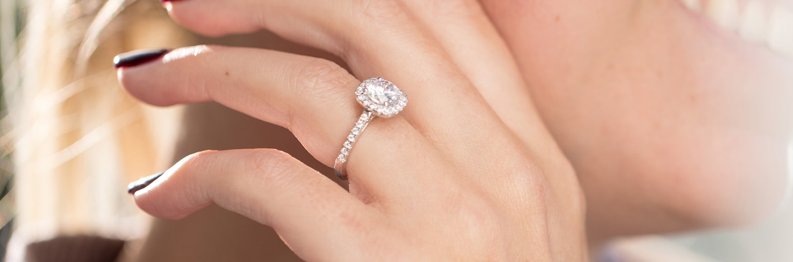 A white gold engagement ring in a halo setting