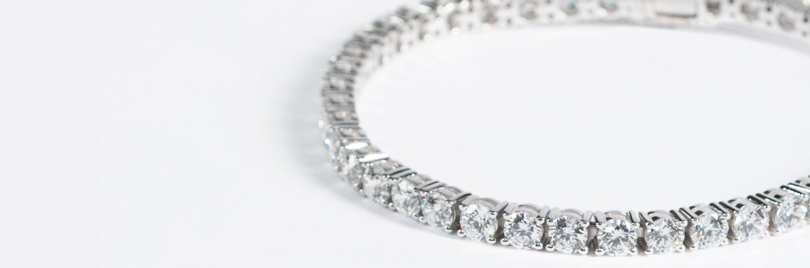A tennis bracelet featuring several round cut diamonds