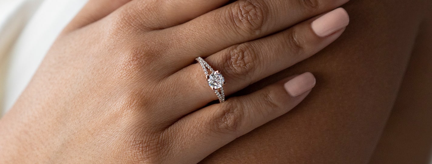 Accented round cut diamond engagement ring