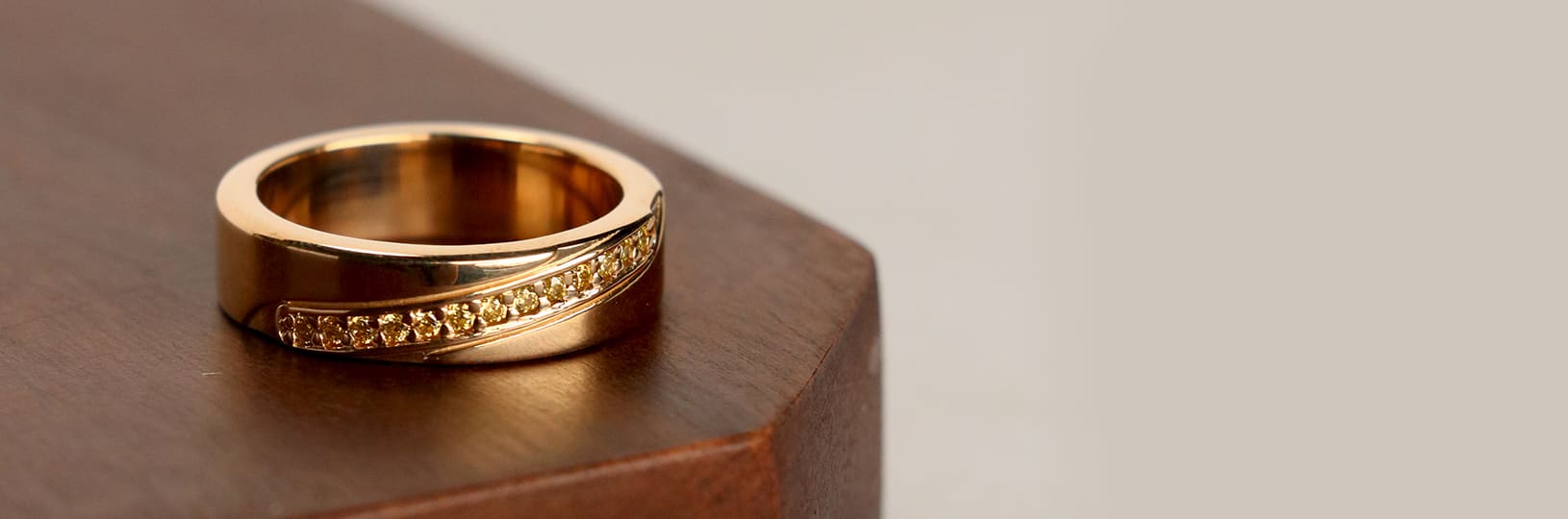 A wedding band with colorful gemstones