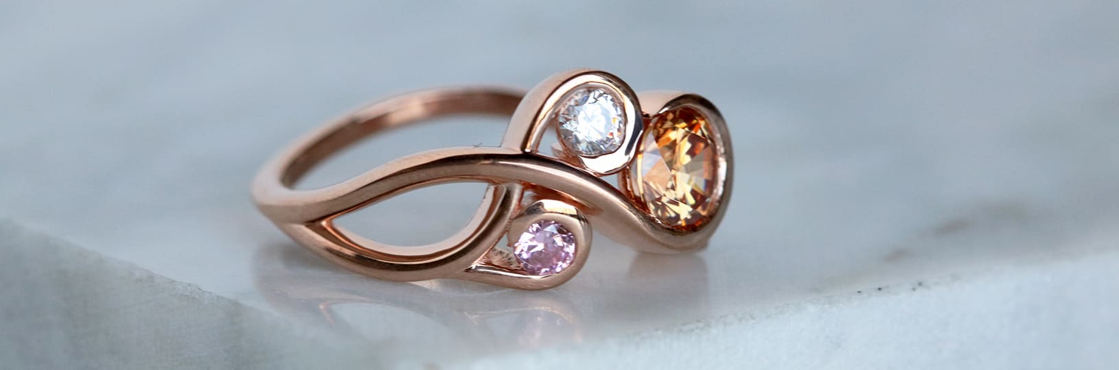 An engagement ring with colorful gemstones