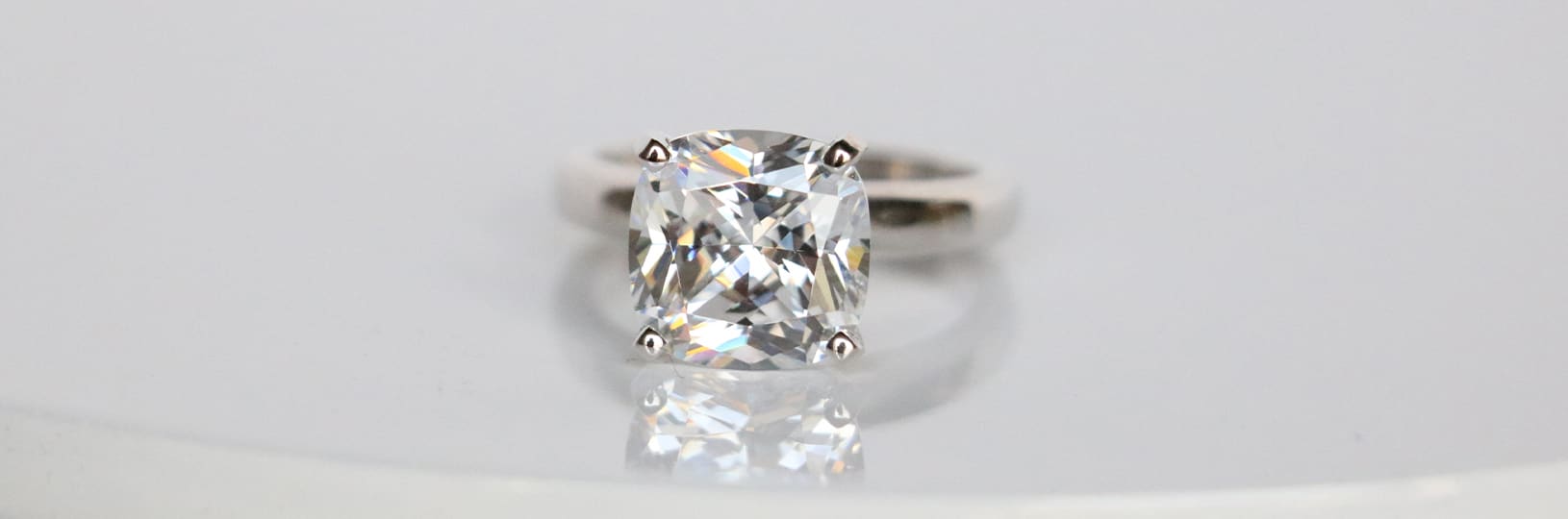 Cushion cut lab created diamond engagement ring.